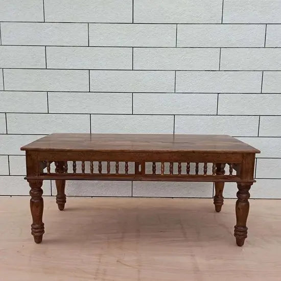 Solid wood traditional rectangular coffee table With turned legs and wooden girli in Bottom panel of Girli coffee Table.