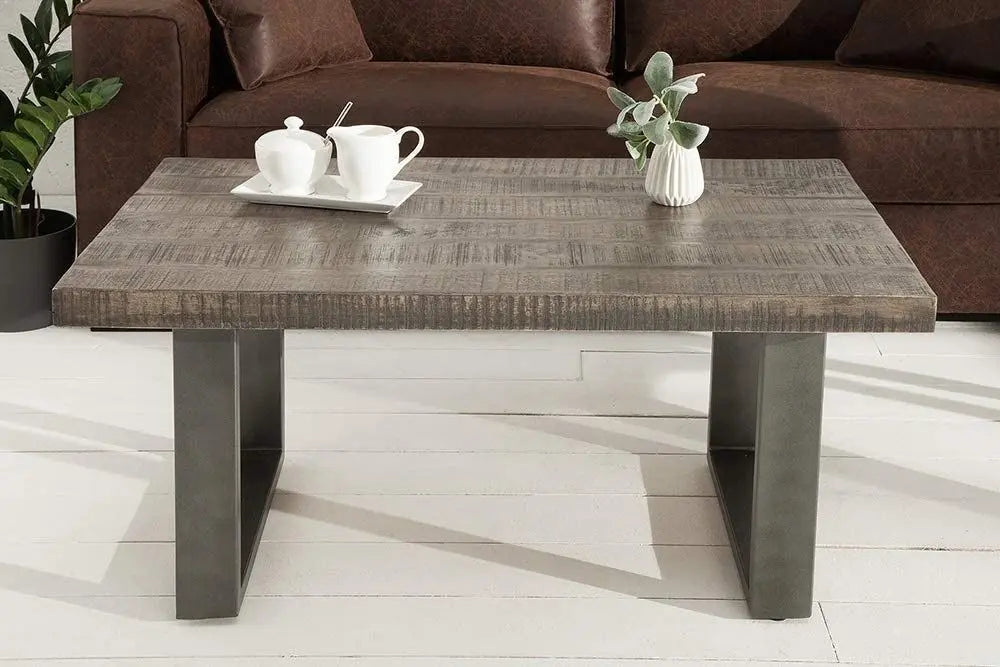 Solid wood and metal frame rectangle shaped dark jett coffee table.