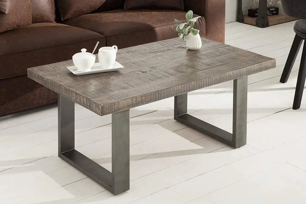 Solid Mango wood and metal frame rectangle shaped dark jett coffee table.