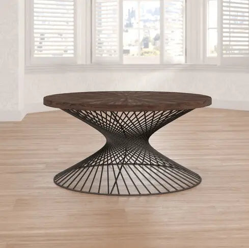 Round wooden table with a black metal base.