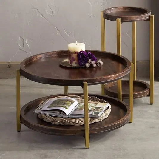 A round, mango wood coffee table with a metal frame and two additional shelves for keeps decorative item and books newspaper etc.