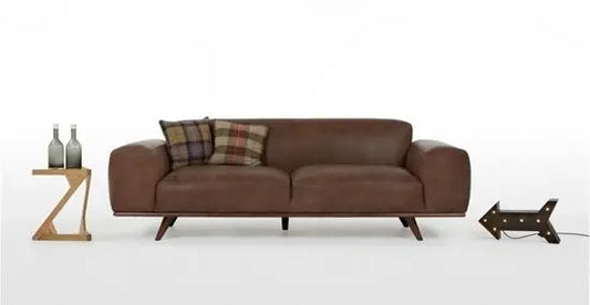 A brown Hopton sofa with a leatherette finish on a Sheesham wood structure, featuring a three-seater design.