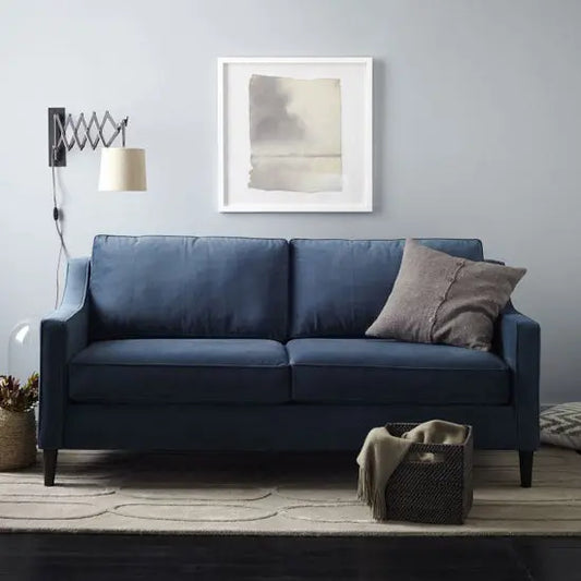 A blue Gavin Sofa with two cushions.