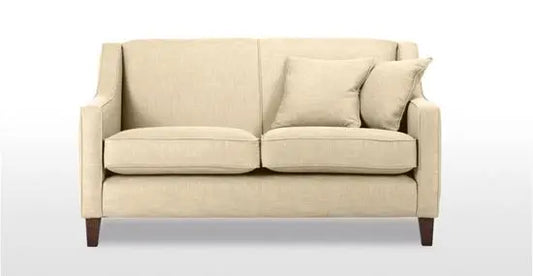 A beige two-seater sofa made with a sturdy Sheesham wood structure, featuring a fabric upholstery, two cushions, and wooden legs.