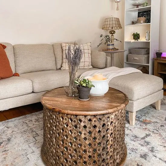 Solid wood Round shaped isha center table in hand-carved sides and geometric patterns.