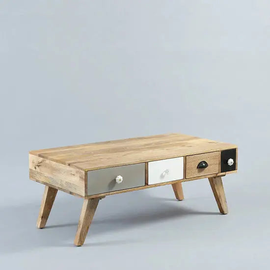 Solid wood rectangular Quatro Coffee Table with multicolored drawers and open shelves.