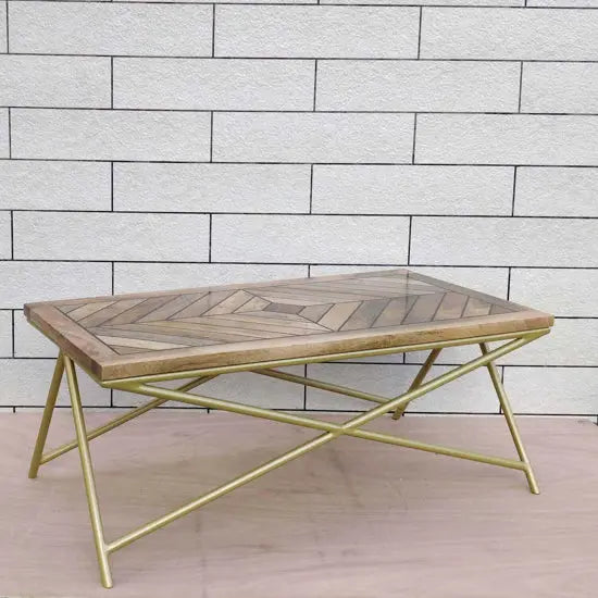 Solid wood and Metal frame herringbone pattern on the top Marbi epoxy coffee table. Metal base painted in golden finish.