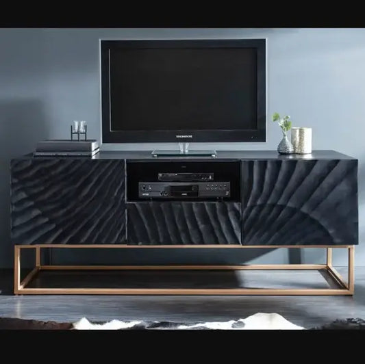 A modern style black TV cabinet with mango wood and metal base, featuring two doors, one drawer, and open shelf, with a flat-screen TV on top.