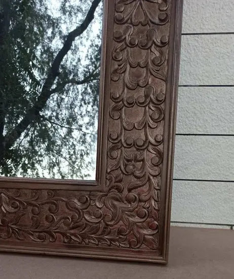 Aklavya mirror with intricate hand carving closer look.