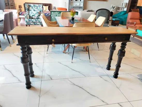 A solid mango wood console table with two drawers, featuring a natural finish on top and a walnut base.