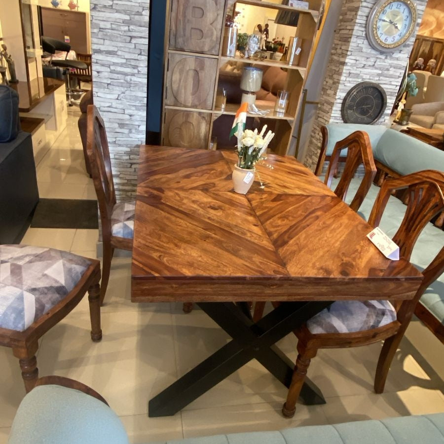 Wooden dining table with herringbone design in sheesham wood with metal legs.