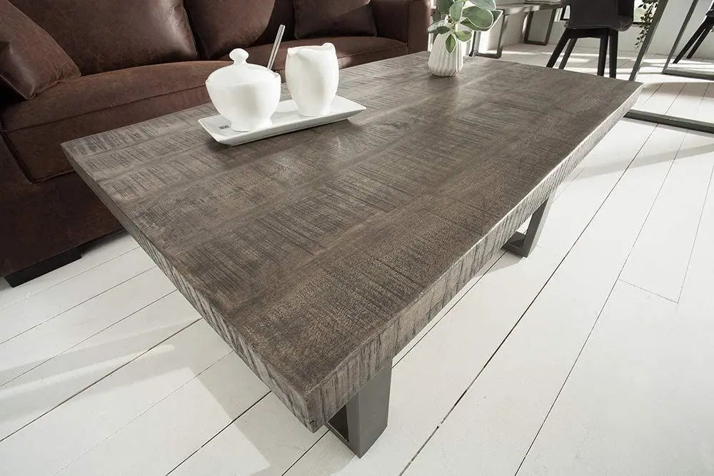 Wooden and metal frame rectangle shaped distress dark jett coffee table.
