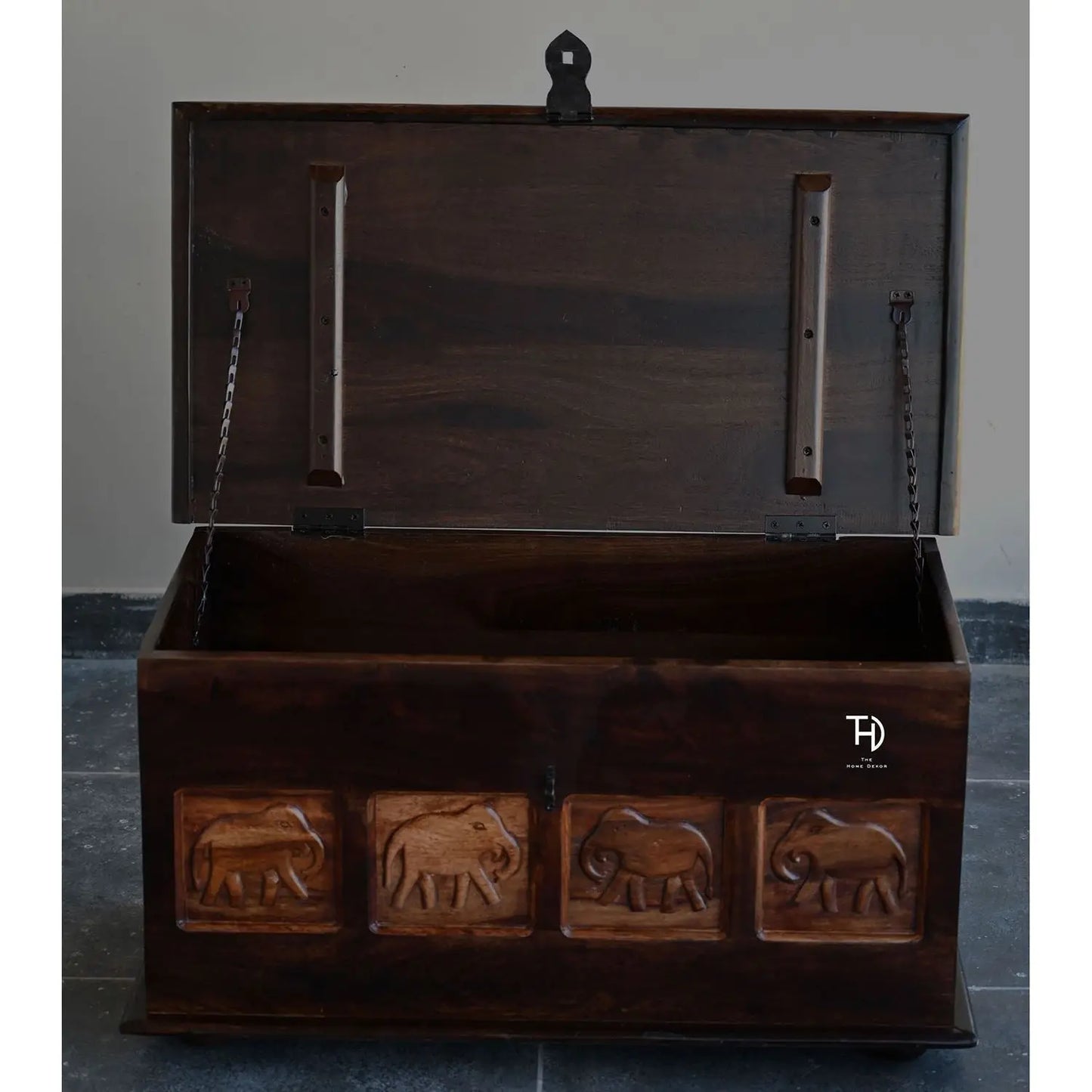 Solid wood Trunk with elephant carvings on Front Panel.