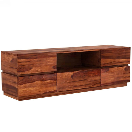 A modern solid wood media console with a warm reddish-brown finish, The console features multiple drawers and open shelving.