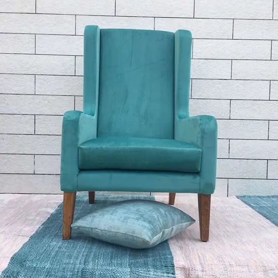 Solid Wood Modern design wing chair in natural finish with green velvet fabric.