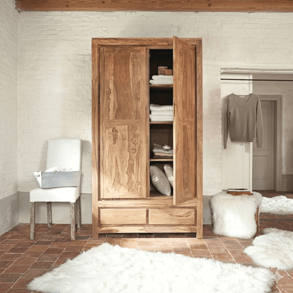 A wooden wardrobe with two doors and two drawers, made of solid Sheesham wood.
