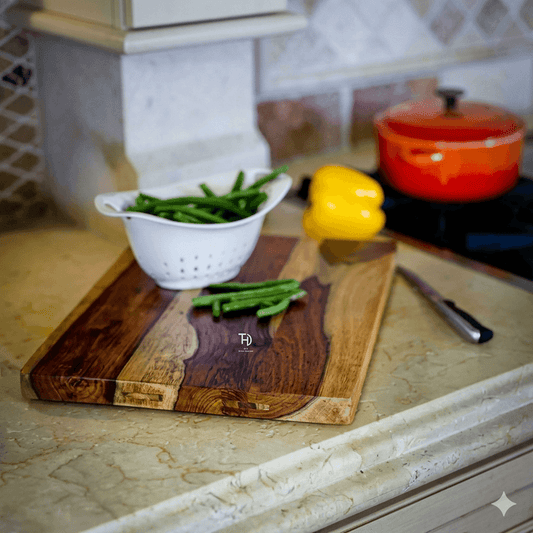 A wooden vegetable chopper is placed on a wooden cutting board. A white bowl with green beans is visible in the background, along with a yellow bell pepper and a red cooking pot.