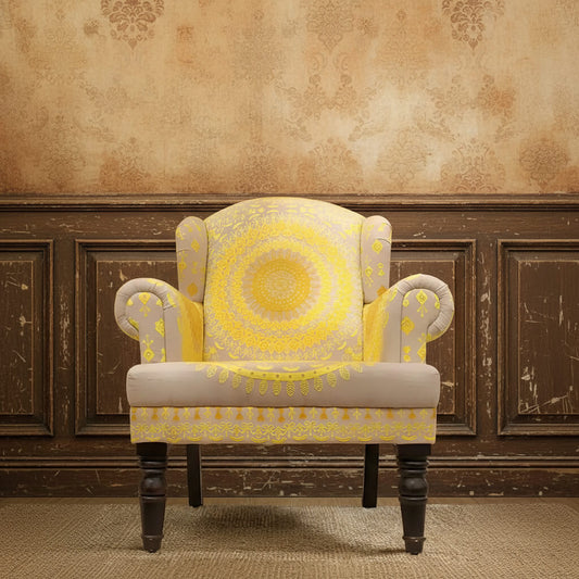 A yellow embroidered upholstered Maharaja sofa with intricate embroidery fabric, featuring a wooden structure and wing chair design.