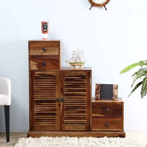 A wooden cabinet with a walnut finish featuring multiple storage spaces, including drawers and doors.