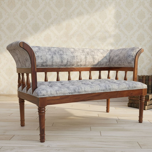 A fabric-upholstered Alvin sofa with Sheesham wood frame and round legs.