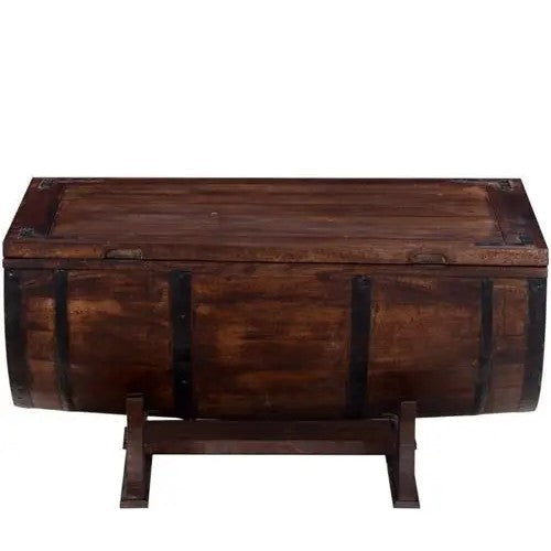 Solid wood barrel shaped coffee table Walnut One top side Upper Door storage with metal strips on the sides.