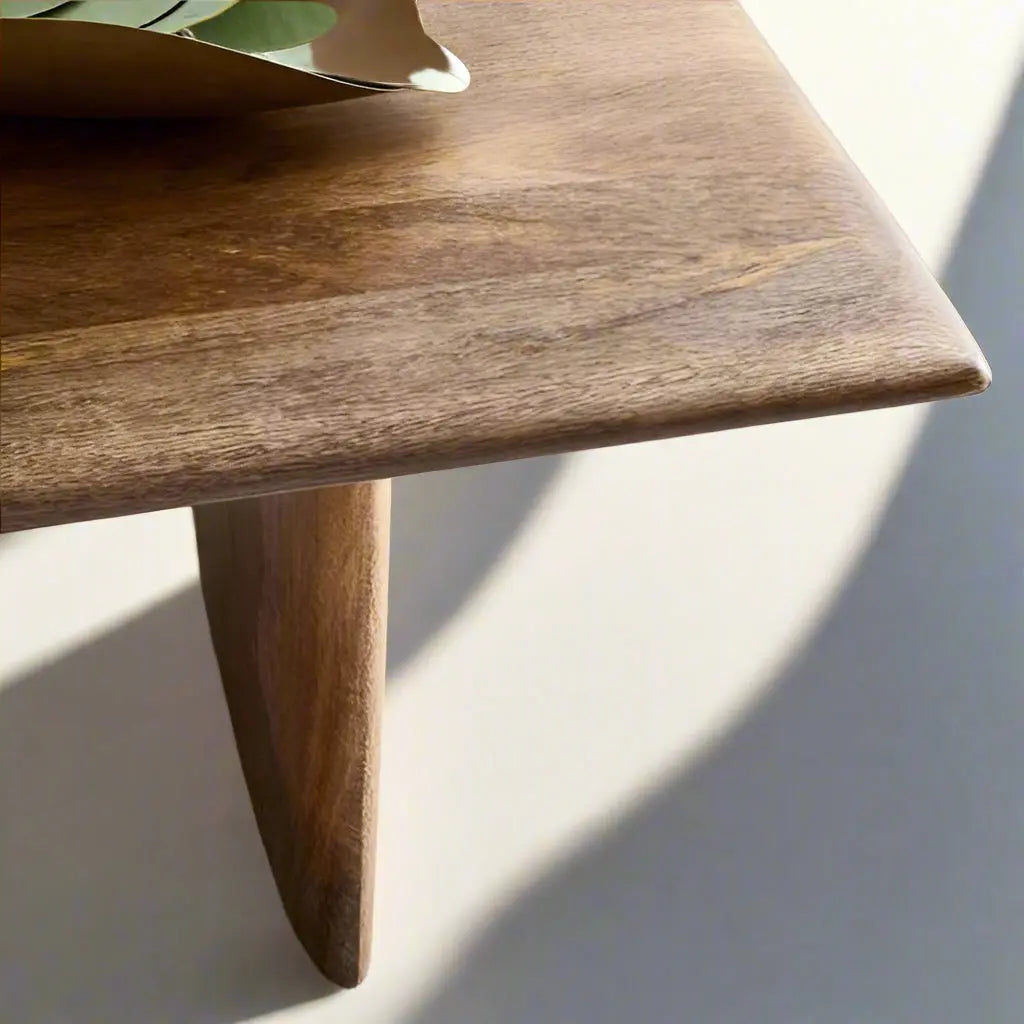 A wooden Rectangular shaped Modern Center Table.  