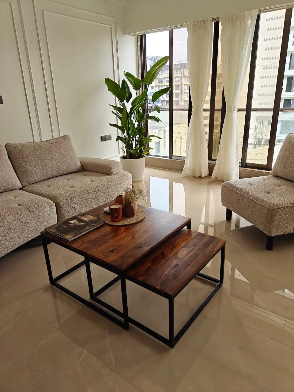 Modern living room with a wooden and metal frame coffee table.  