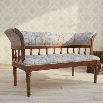 A fabric-upholstered Alvin sofa with Sheesham wood frame and round legs.