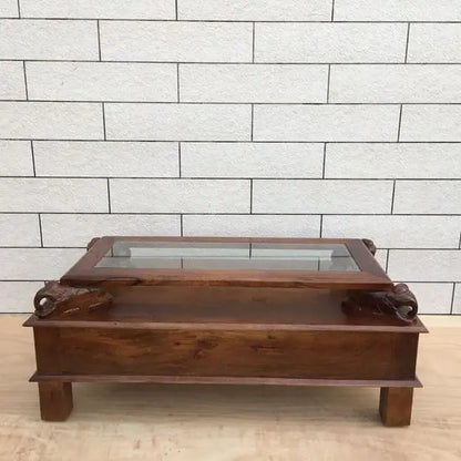 wooden rectangular brown Three drawer and carved elephant details on the sides Asgil coffee table.