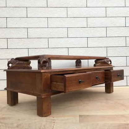 Mango wood rectangular brown Three drawer and carved elephant details on the sides Asgil coffee table.