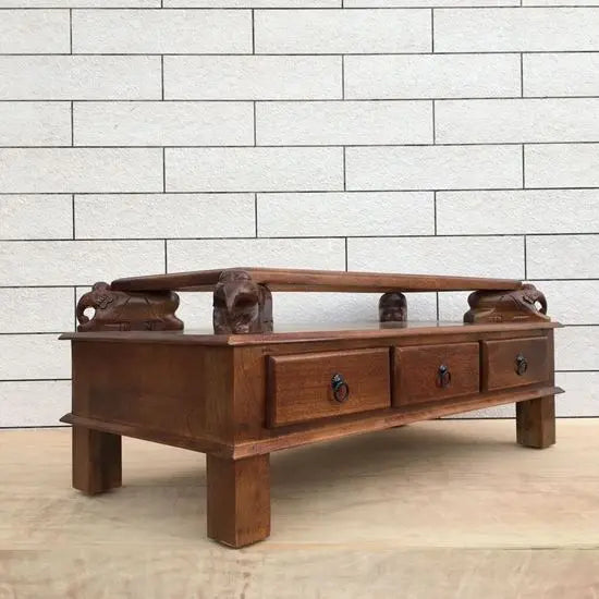 Solid mango wood rectangular brown Three drawer and carved elephant details on the sides Asgil coffee table.