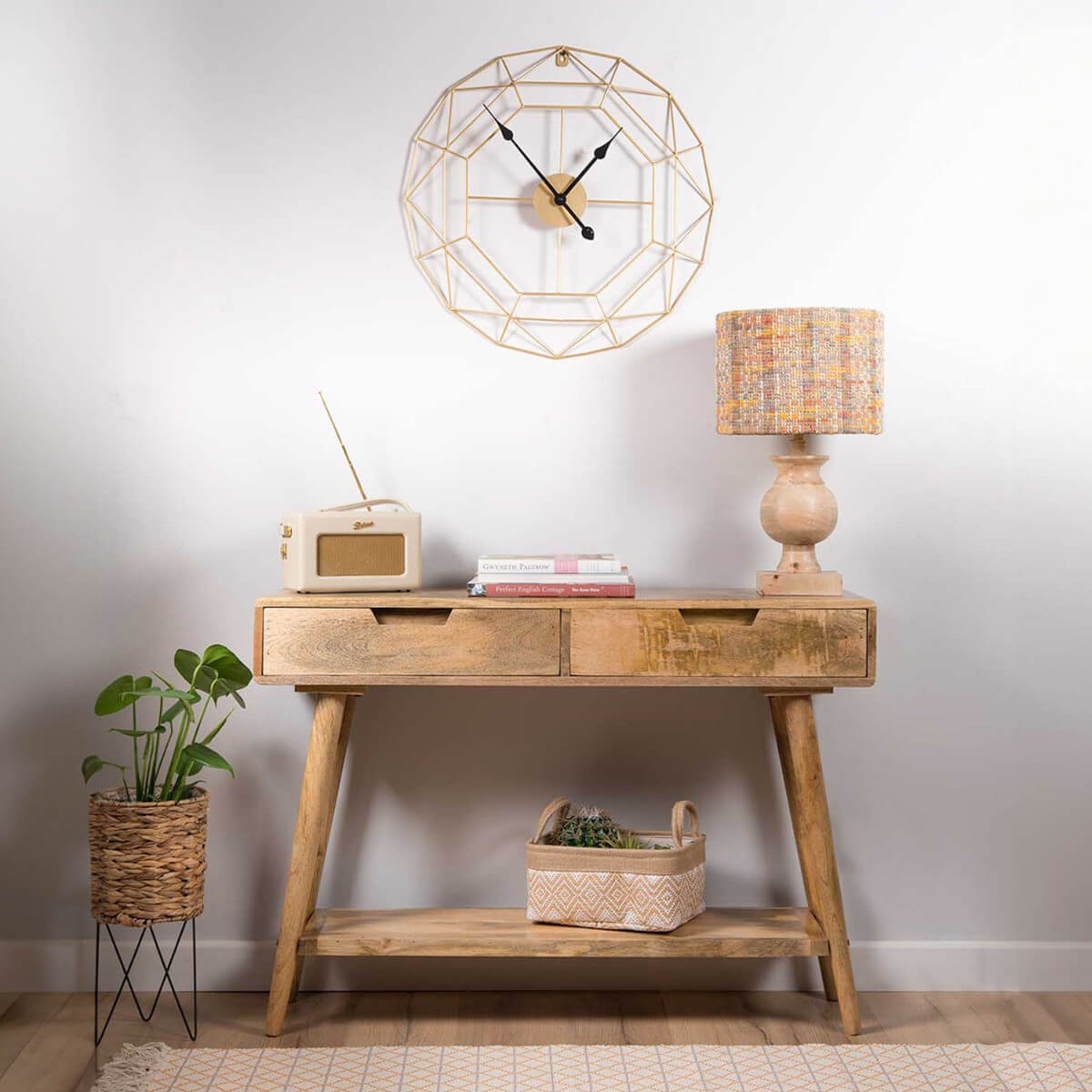 A rustic light brown mango wood console table.