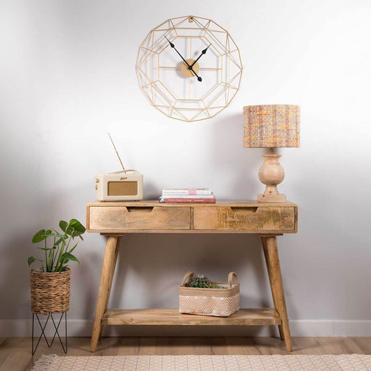 A rustic light brown mango wood console table.