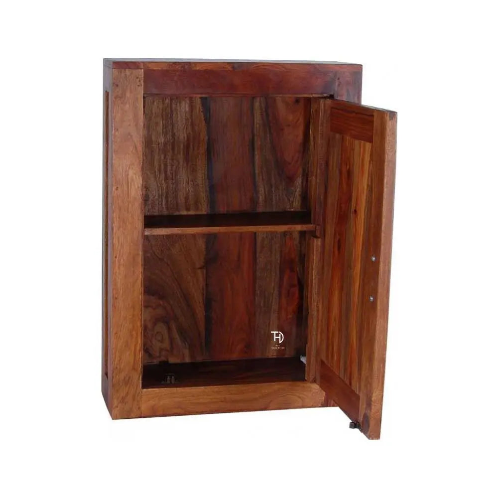 Wooden cabinet with open door with shelf.