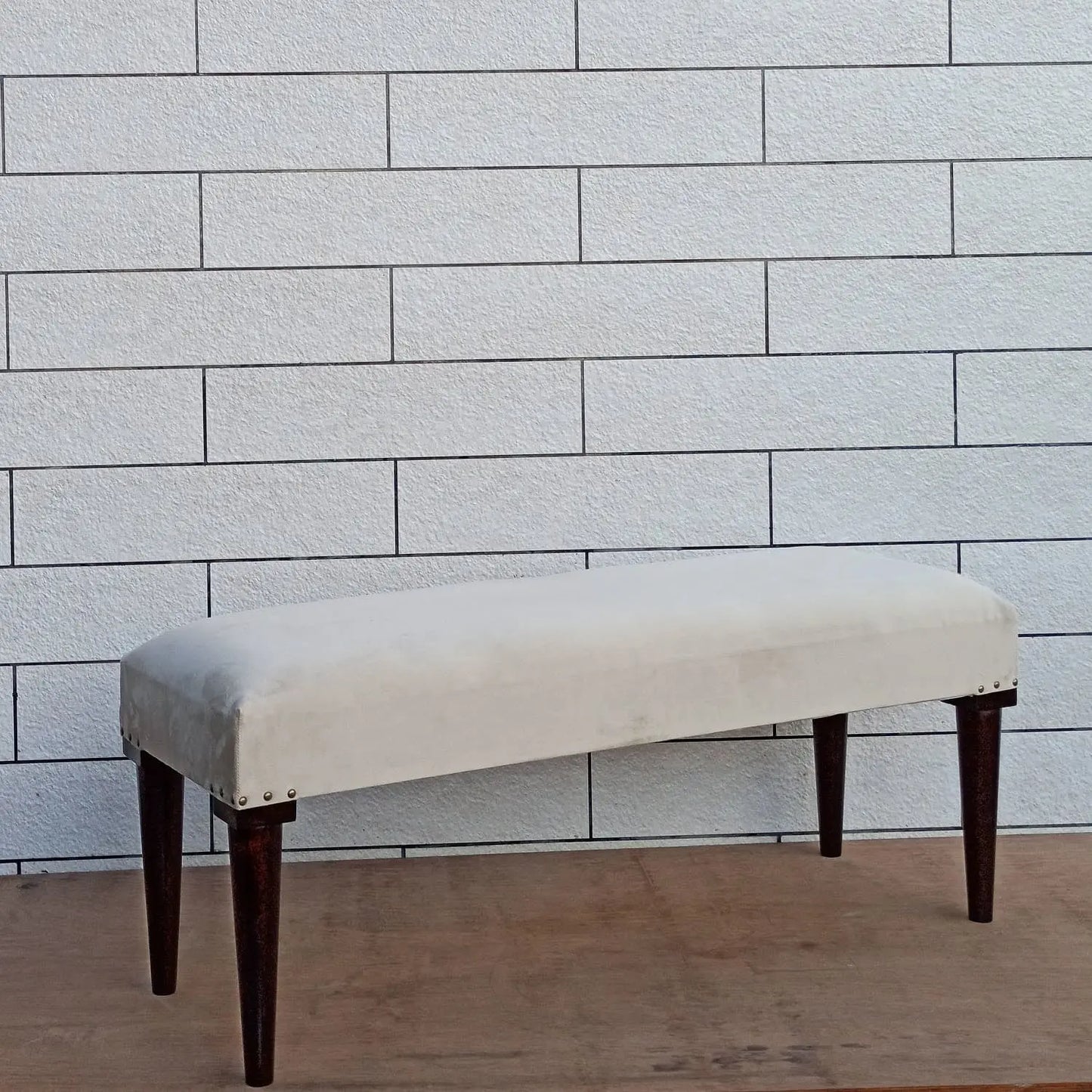 Solid Sheesham wood Beige upholstered bench with dark round wooden legs.