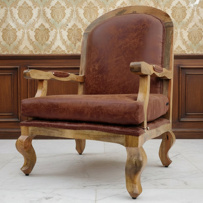 A brown upholstered cushioned chair with curved wooden legs and a tufted backrest.