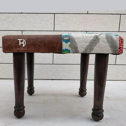 A brown and multicolor patchwork stool.