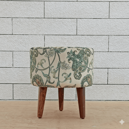 Small ottoman with a patterned cushion.