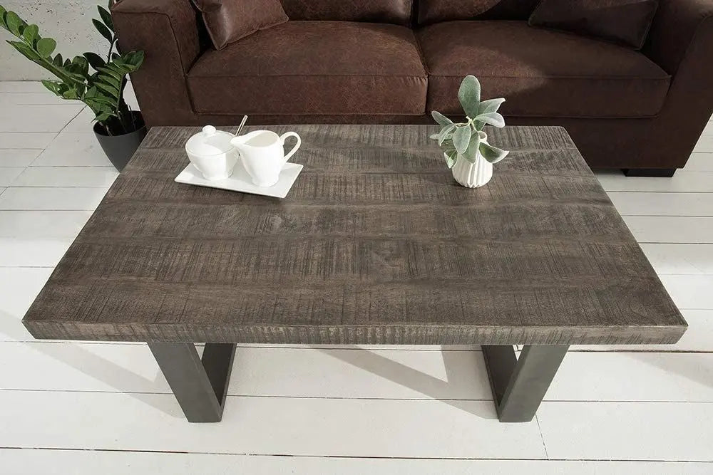 wooden and metal frame rectangle shaped dark jett coffee table.   