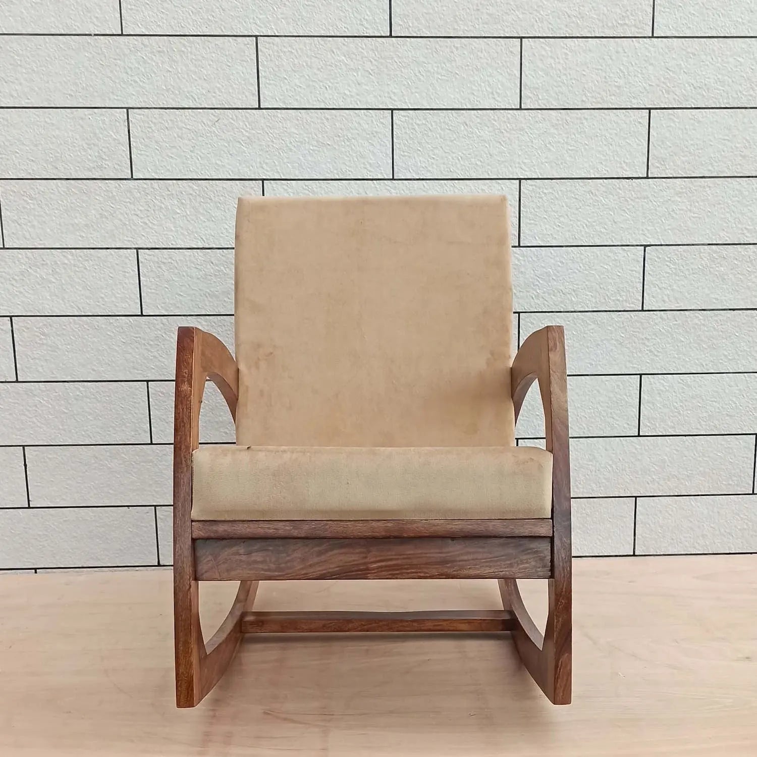 Beige cushioned Designer rocking chair with wooden frame. 