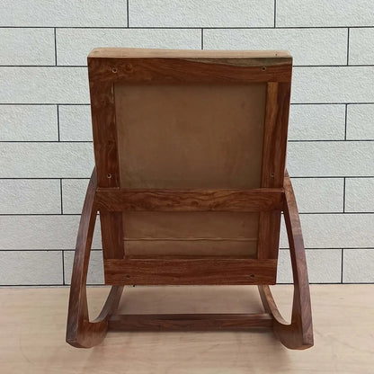 Solid sheesham wood designer rocking chair with beige cushion.
