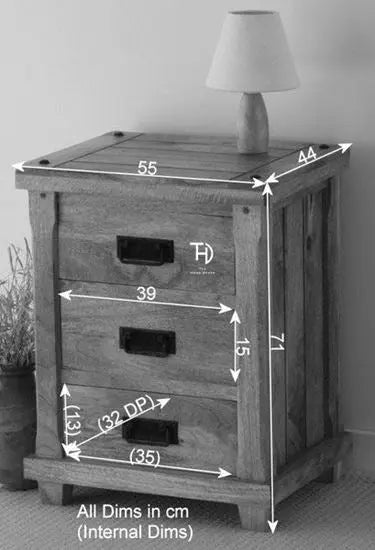 Solid mango wood three drawer devi bedside table with featuring metal handles.