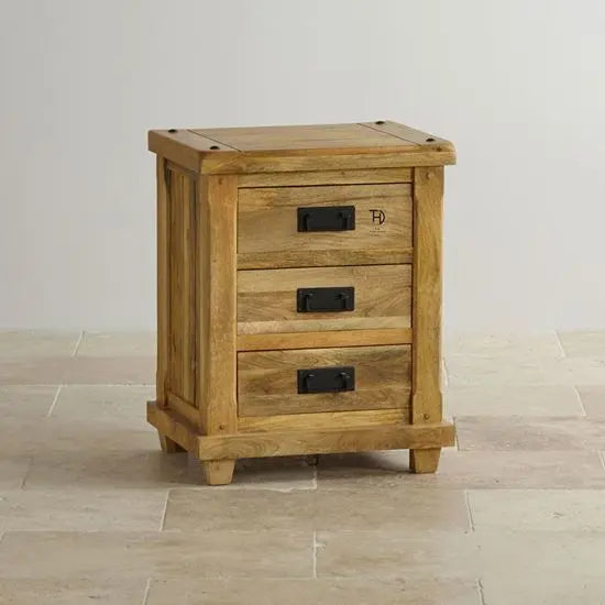 Solid wood three drawer devi bedside table with featuring metal handles.