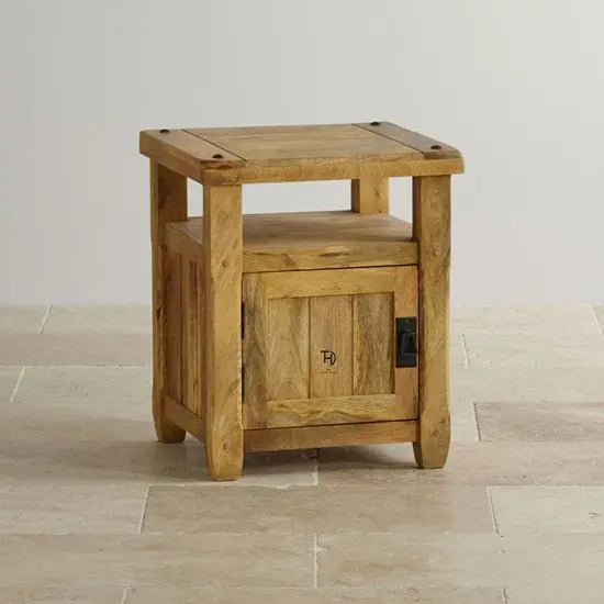 A mango wood bedside table with one door and an open shelf. 