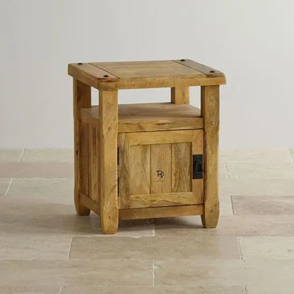 A mango wood bedside table with one door and an open shelf. 