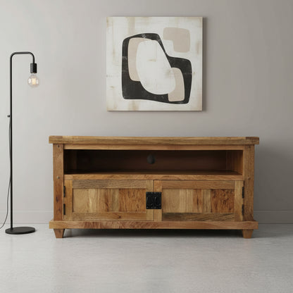 A wooden Devi TV cabinet with an open shelf and a closed compartment with a door, presented in an online product setting against a neutral background.
