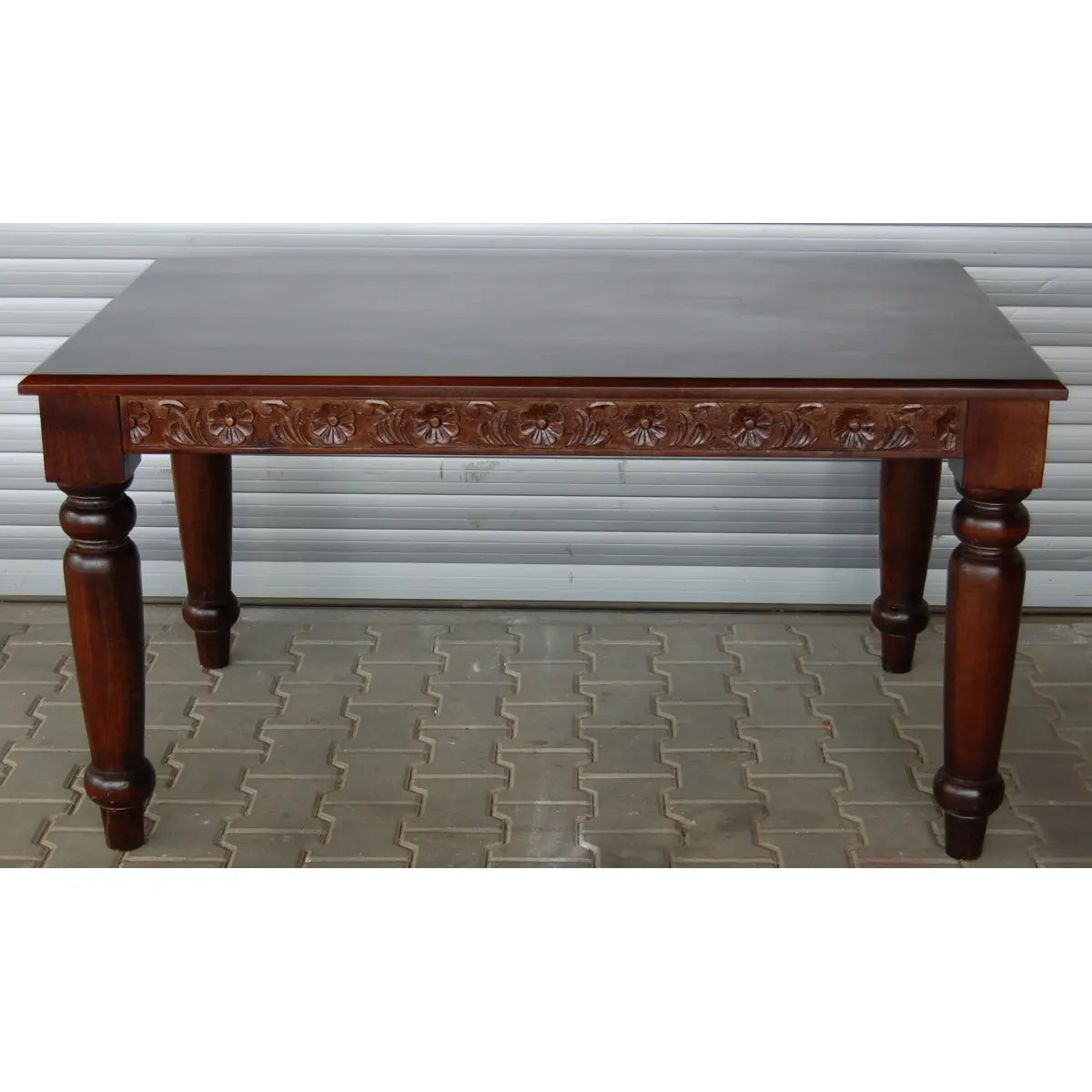 Solid wood Dome four seater dining table with intricate carvings.