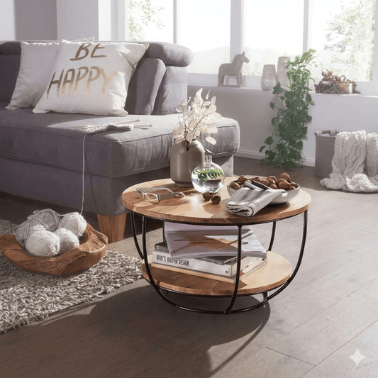 A round coffee table with acacia wood top and black metal frame with two shelves for keeps items. 
