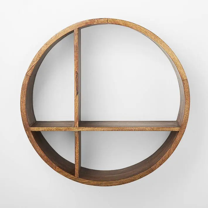 Wooden circular shelf with four compartments for keeps books and decorative items.