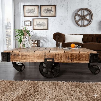 Distress finish industrial kart coffee table made in solid mango wood with featuring cast iron corners and wheels. 